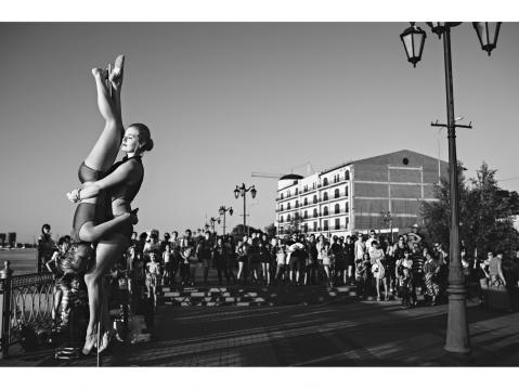 Astrakhan – RUSSIA 4 July 2015. Two women performs Pole dancing in the Volga´s riverside.