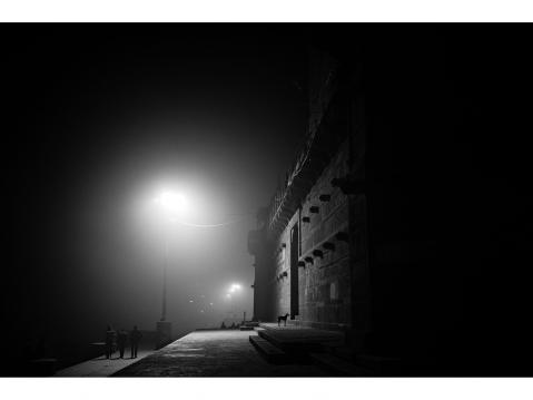 Varanasi – INDIA 1 January 2016. A dog looks inside a building near a Ghat in the shore of the Ganga river.