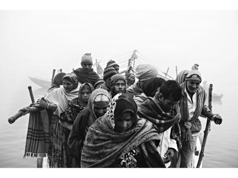 Varanasi – INDIA 2 January 2016. A group of pilgrims arrive at Lalita Ghat on their way to the Nepali Temple.