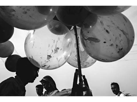 Pushkar – INDIA 25 November 2015. A man sells balloons for kids during The Pushkar Camel Fair in Rajasthan.