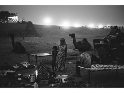 Pushkar – INDIA 25 November 2015. A family of cameleers rest during The Pushkar Camel Fair in Rajasthan which is one of the world’s largest camel fairs.